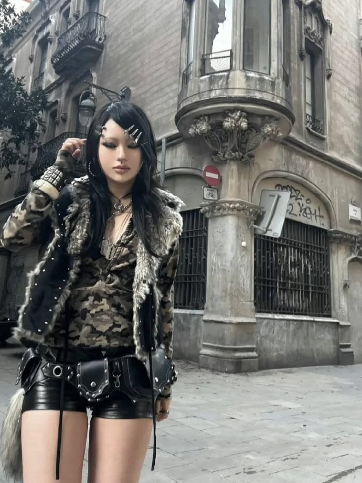 Look 06: camo top, fur-trim jacket, leather shorts